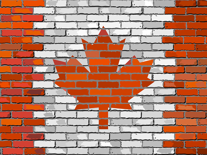 Mur de briques avec l'image du drapeau canadien.
