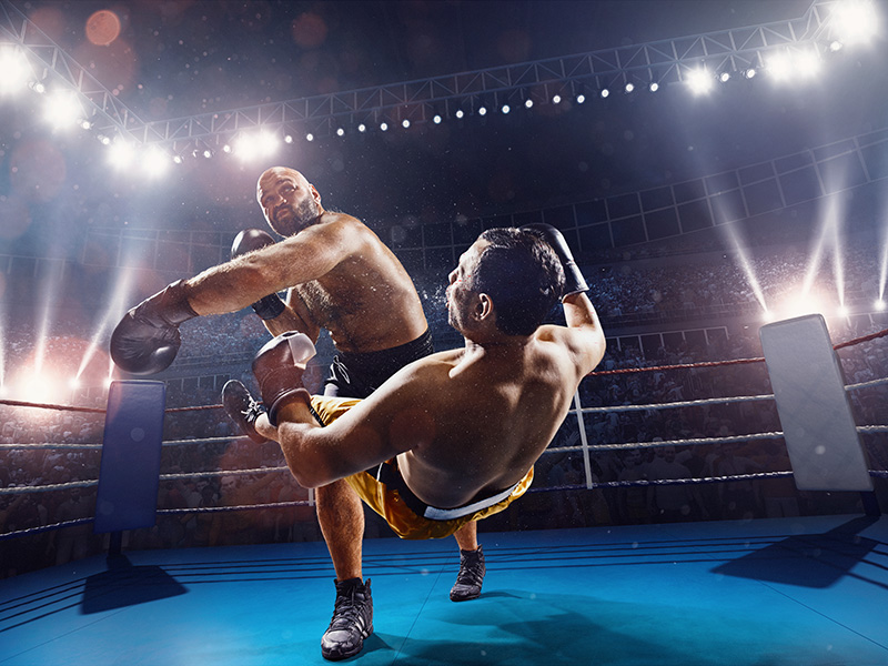 Deux boxeurs s'affrontant sur un ring.