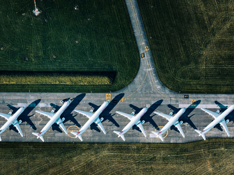 A long line of parked airplanes